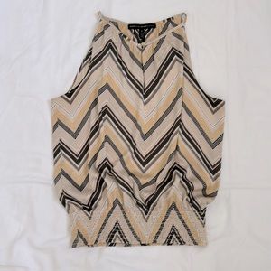 White House Black Market sleeveless chevron print top. Size 6